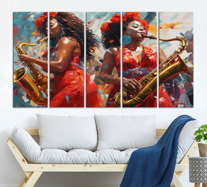 The "Abstract African American Saxophonist Musician Women Wall Art" features a three-panel design depicting two women in red dresses playing saxophones. This premium canvas boasts a gallery-quality finish that enhances any living space with its vibrant charm.