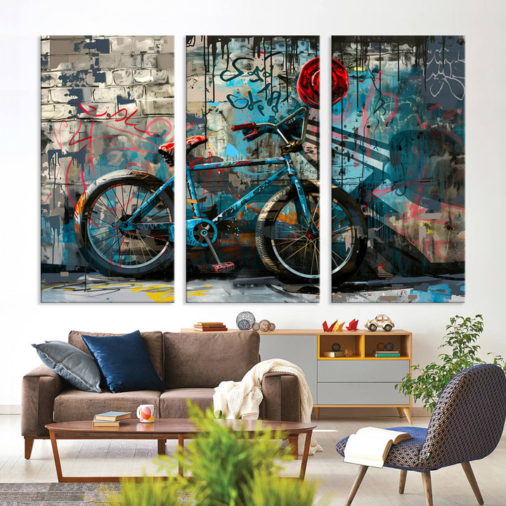 A modern living room features a triptych wall art of an abstract bicycle, designed in a graffiti style on a brick wall. This piece is expertly crafted on the Abstract Bicycle Wall Art Canvas Print, offering a premium canvas that ensures a gallery-quality finish.