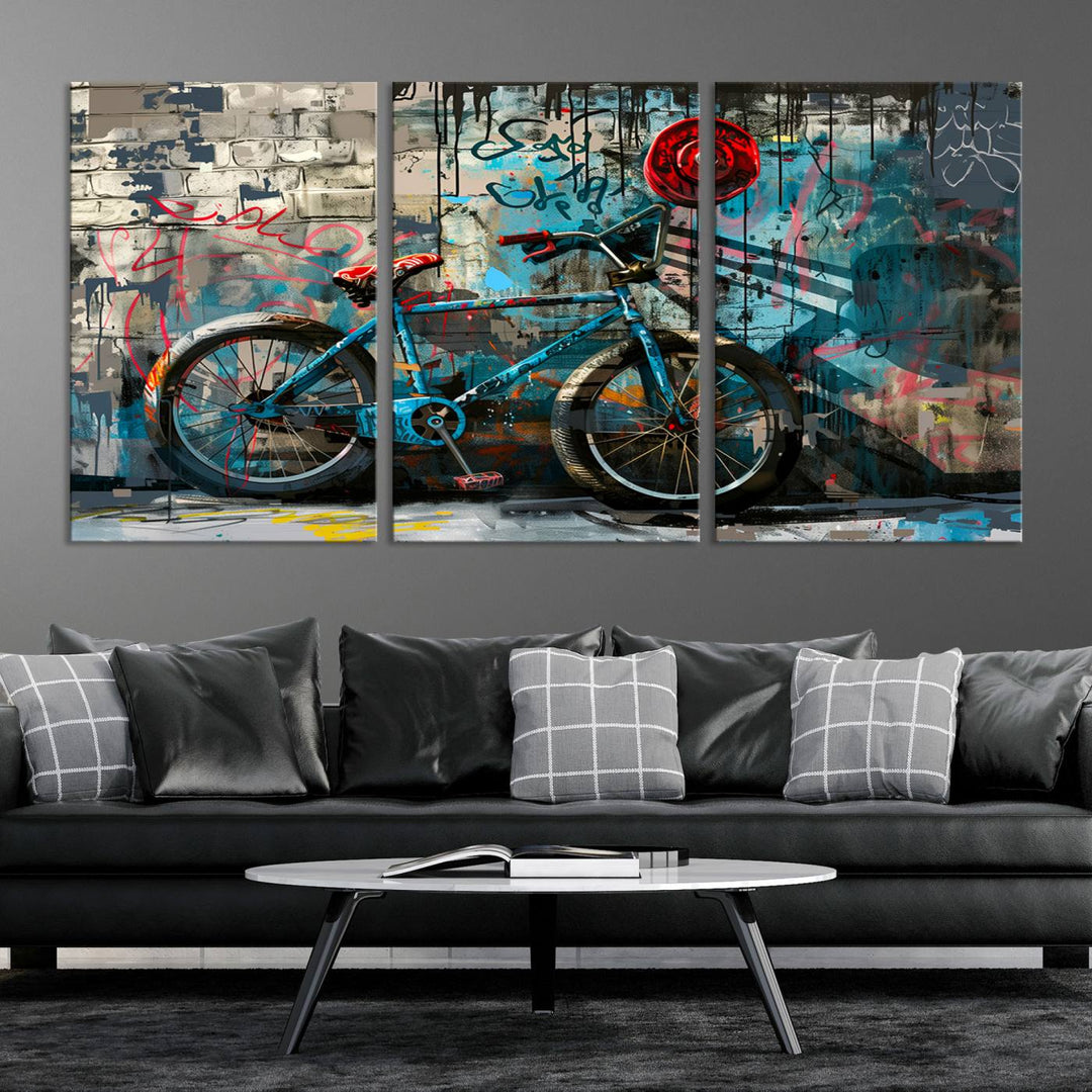 A modern living room features a triptych wall art of an abstract bicycle, designed in a graffiti style on a brick wall. This piece is expertly crafted on the Abstract Bicycle Wall Art Canvas Print, offering a premium canvas that ensures a gallery-quality finish.