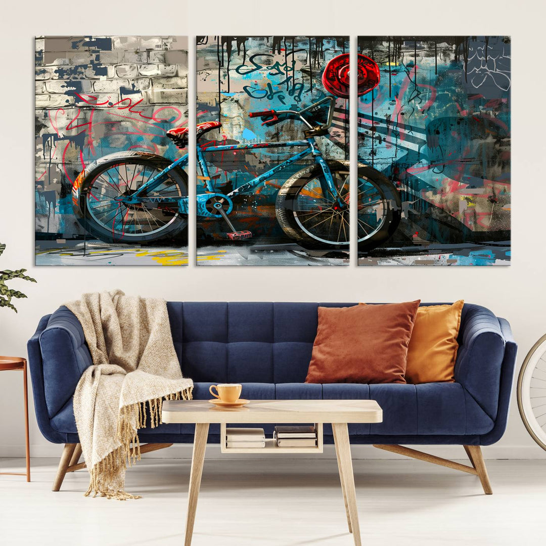 A modern living room features a triptych wall art of an abstract bicycle, designed in a graffiti style on a brick wall. This piece is expertly crafted on the Abstract Bicycle Wall Art Canvas Print, offering a premium canvas that ensures a gallery-quality finish.