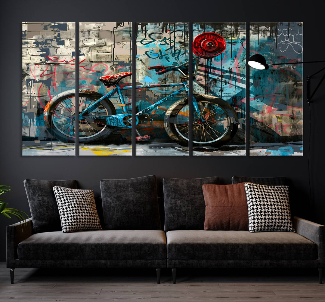 A modern living room features a triptych wall art of an abstract bicycle, designed in a graffiti style on a brick wall. This piece is expertly crafted on the Abstract Bicycle Wall Art Canvas Print, offering a premium canvas that ensures a gallery-quality finish.