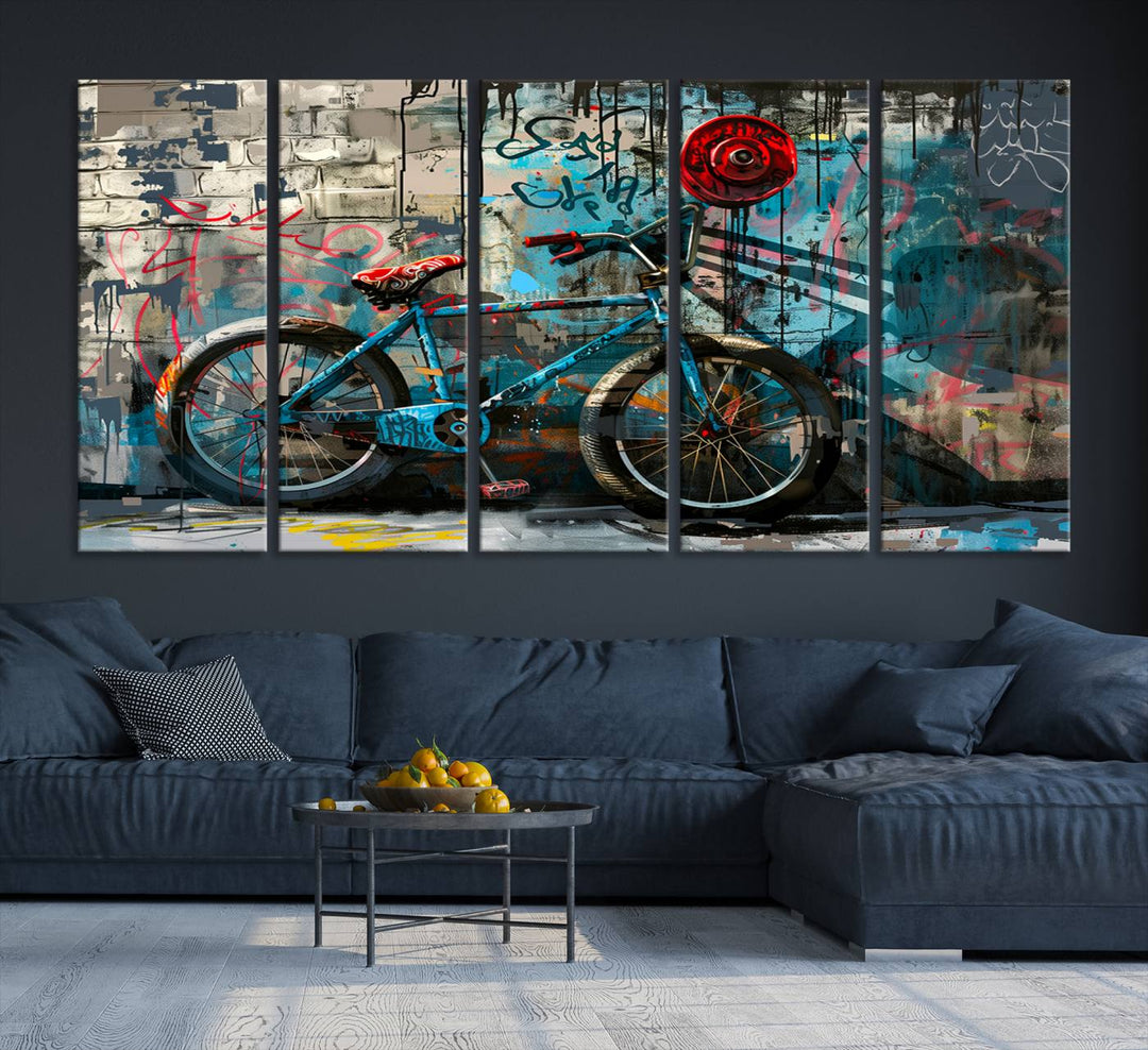 A modern living room features a triptych wall art of an abstract bicycle, designed in a graffiti style on a brick wall. This piece is expertly crafted on the Abstract Bicycle Wall Art Canvas Print, offering a premium canvas that ensures a gallery-quality finish.