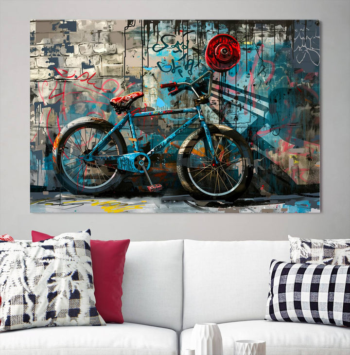 A modern living room features a triptych wall art of an abstract bicycle, designed in a graffiti style on a brick wall. This piece is expertly crafted on the Abstract Bicycle Wall Art Canvas Print, offering a premium canvas that ensures a gallery-quality finish.