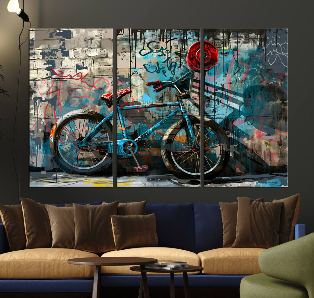 A modern living room features a triptych wall art of an abstract bicycle, designed in a graffiti style on a brick wall. This piece is expertly crafted on the Abstract Bicycle Wall Art Canvas Print, offering a premium canvas that ensures a gallery-quality finish.