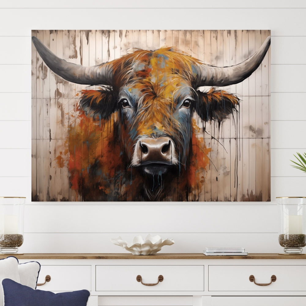 The Abstract Bull Highland Cow Canvas Wall Art Print, featuring its large horns, is mounted on a white wall, introducing a vibrant rustic charm that enhances the modern farmhouse style.