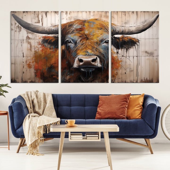 The Abstract Bull Highland Cow Canvas Wall Art Print, featuring its large horns, is mounted on a white wall, introducing a vibrant rustic charm that enhances the modern farmhouse style.