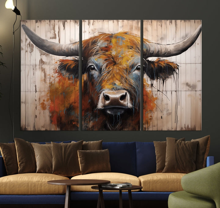 The Abstract Bull Highland Cow Canvas Wall Art Print, featuring its large horns, is mounted on a white wall, introducing a vibrant rustic charm that enhances the modern farmhouse style.