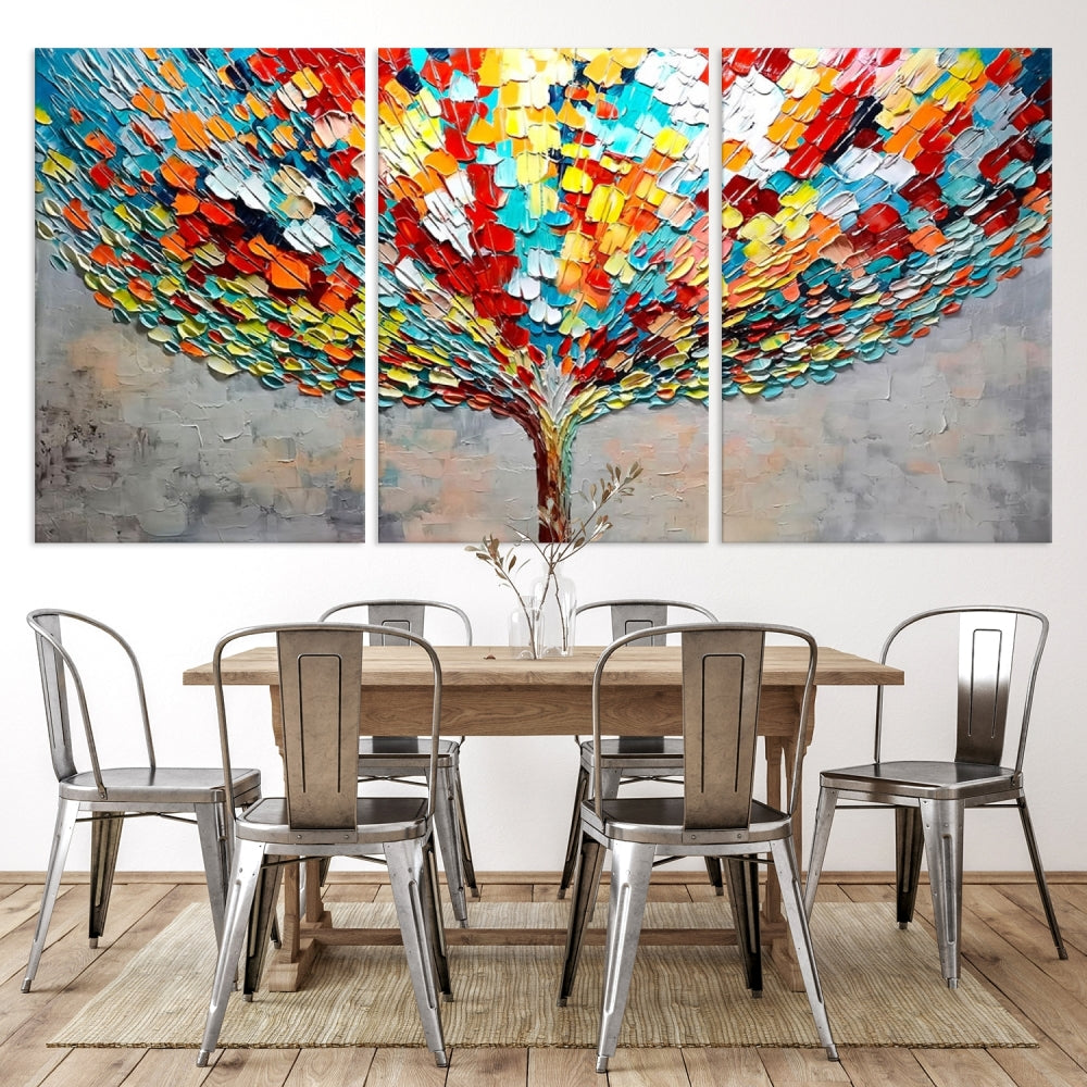 The Abstract Colorful Tree Wall Art beautifully adorns the room on a museum-quality canvas. It establishes a vibrant yet harmonious ambiance in the dining area.