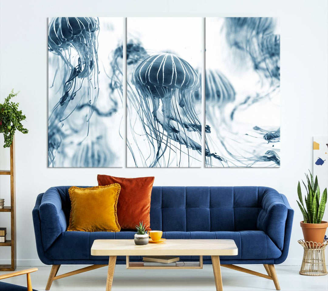 The "Abstract Jellyfish Wall Art Canvas Print" in high resolution is beautifully displayed as a triptych on a dark wall. Experience museum-quality canvas and enjoy free shipping with this stunning piece.