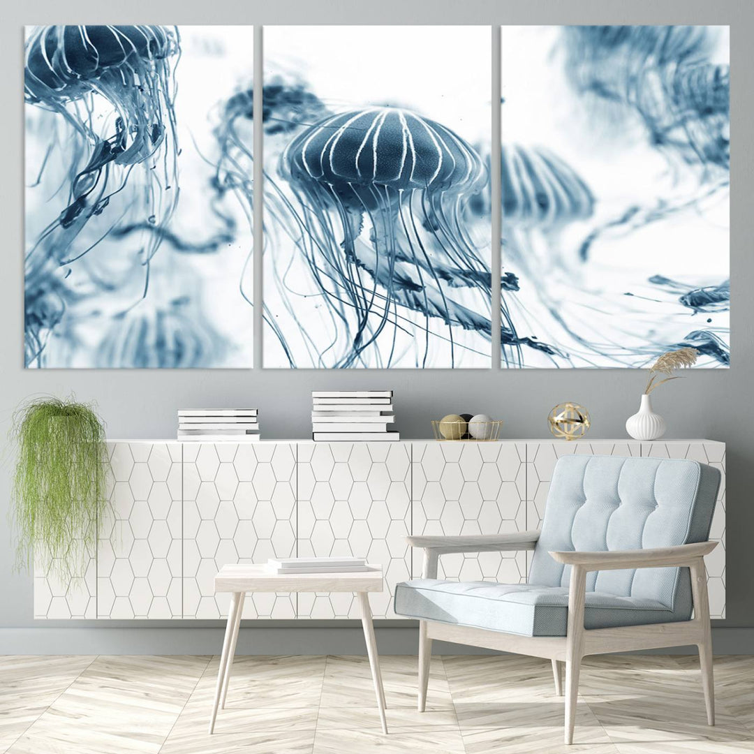 The "Abstract Jellyfish Wall Art Canvas Print" in high resolution is beautifully displayed as a triptych on a dark wall. Experience museum-quality canvas and enjoy free shipping with this stunning piece.