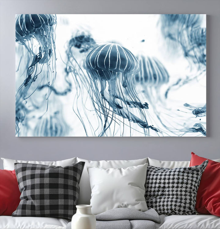 The "Abstract Jellyfish Wall Art Canvas Print" in high resolution is beautifully displayed as a triptych on a dark wall. Experience museum-quality canvas and enjoy free shipping with this stunning piece.