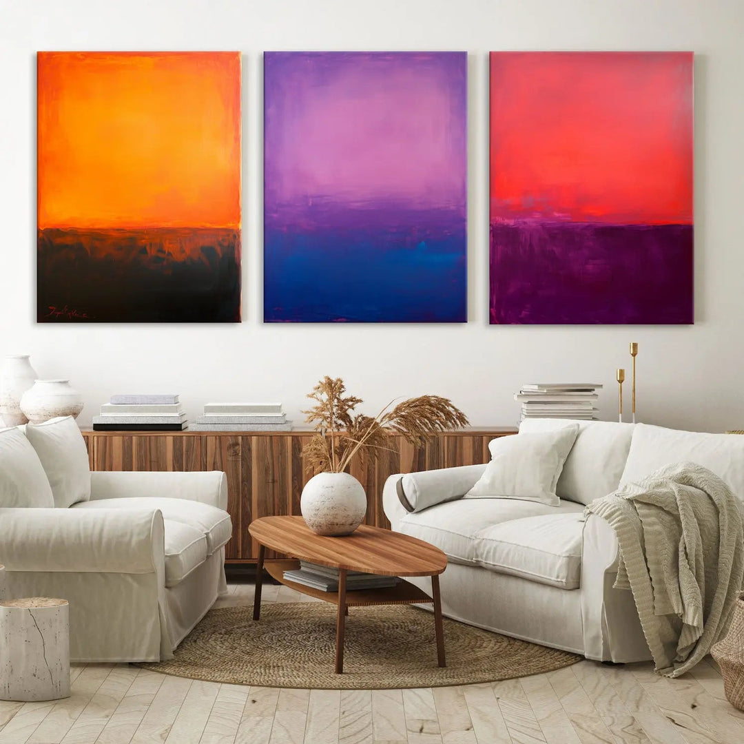 The contemporary living room is enhanced by the vibrant Abstract Mark Rothko Wall Art Set Print, featuring orange, purple, and red tones that echo Mark Rothko's style.