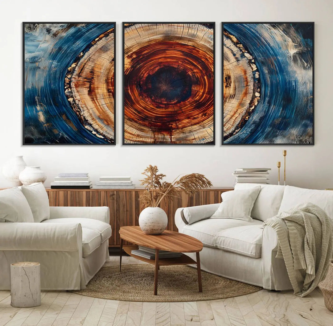 The living room features an abstract Tree Rings Wall Art in blue and orange.