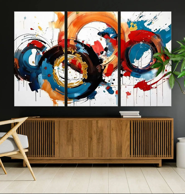 The Abstract Wall Art Rings Canvas Print, with its bold and colorful circular strokes, adorns the wall, epitomizing contemporary design.