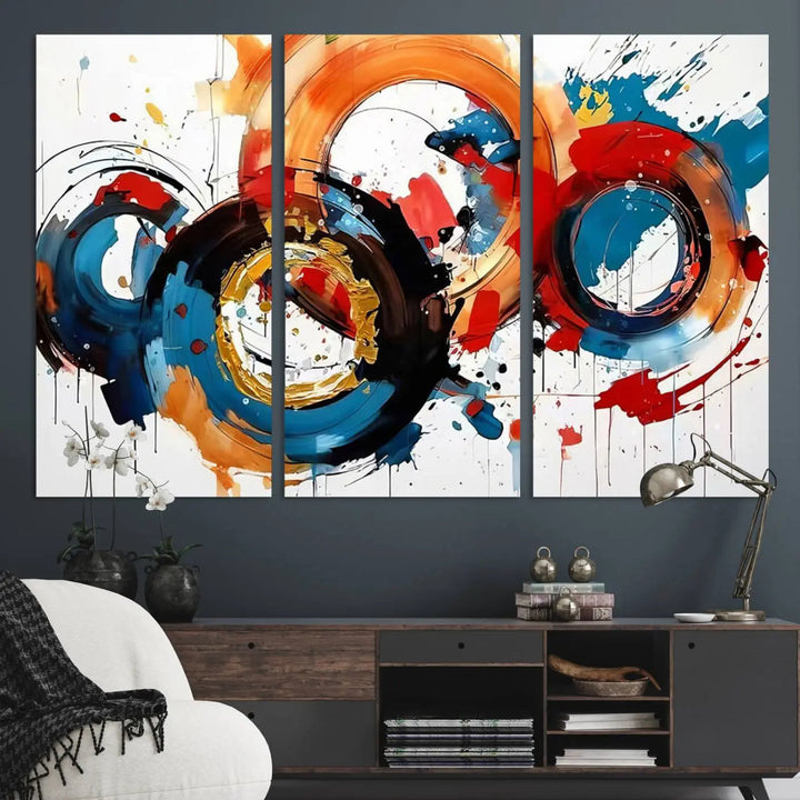 The Abstract Wall Art Rings Canvas Print, with its bold and colorful circular strokes, adorns the wall, epitomizing contemporary design.