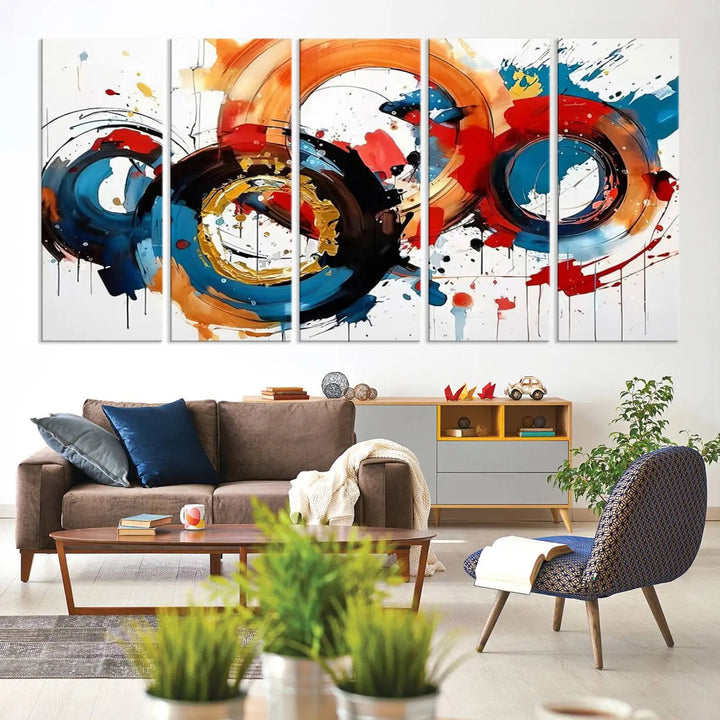 The Abstract Wall Art Rings Canvas Print, with its bold and colorful circular strokes, adorns the wall, epitomizing contemporary design.