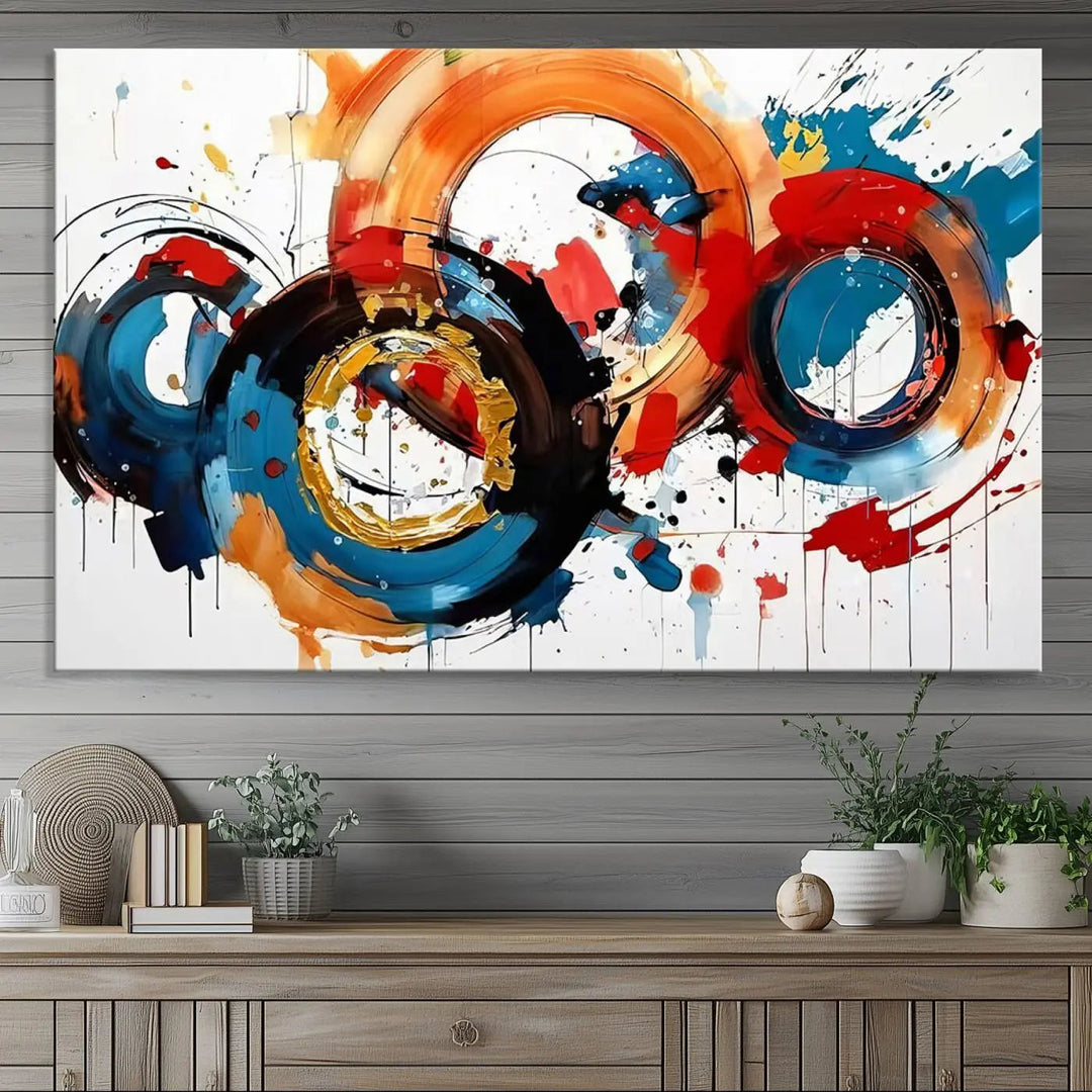 The Abstract Wall Art Rings Canvas Print, with its bold and colorful circular strokes, adorns the wall, epitomizing contemporary design.