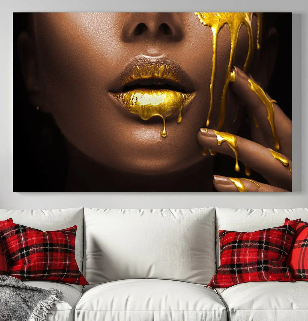 A triptych art display of the African American Art Black Woman Canvas Print, featuring gold-painted lips inspired by fashion and luxury, is elegantly arranged.