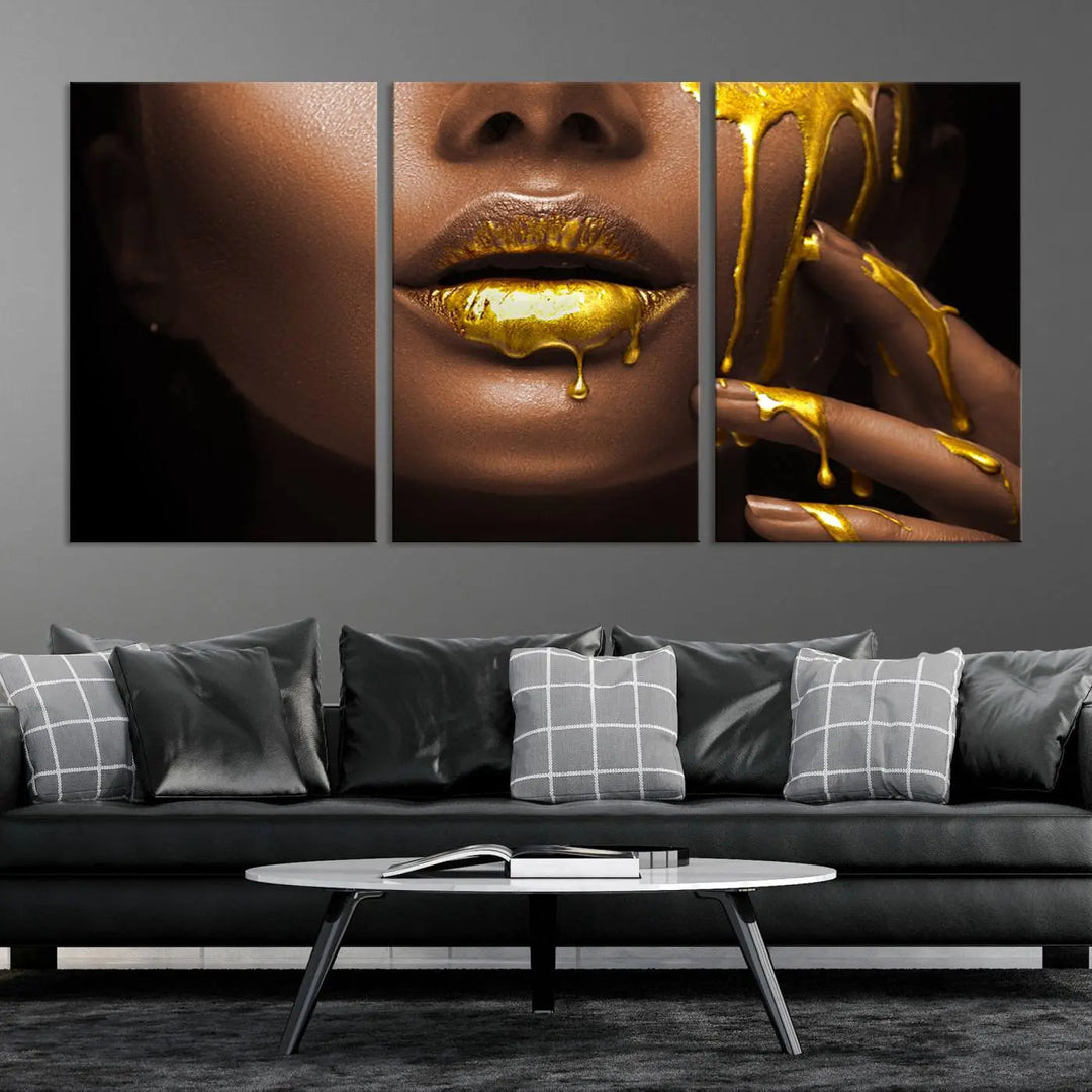 A triptych art display of the African American Art Black Woman Canvas Print, featuring gold-painted lips inspired by fashion and luxury, is elegantly arranged.