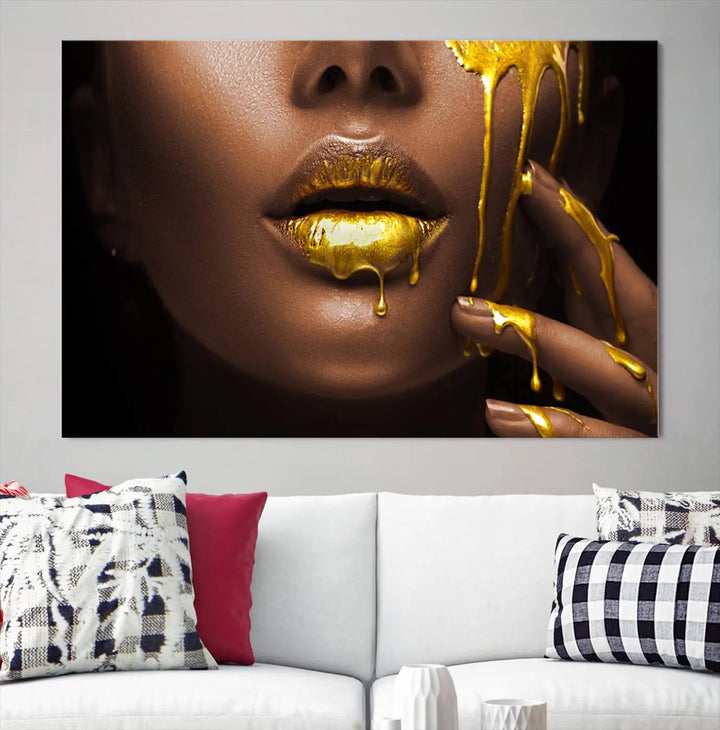 A triptych art display of the African American Art Black Woman Canvas Print, featuring gold-painted lips inspired by fashion and luxury, is elegantly arranged.