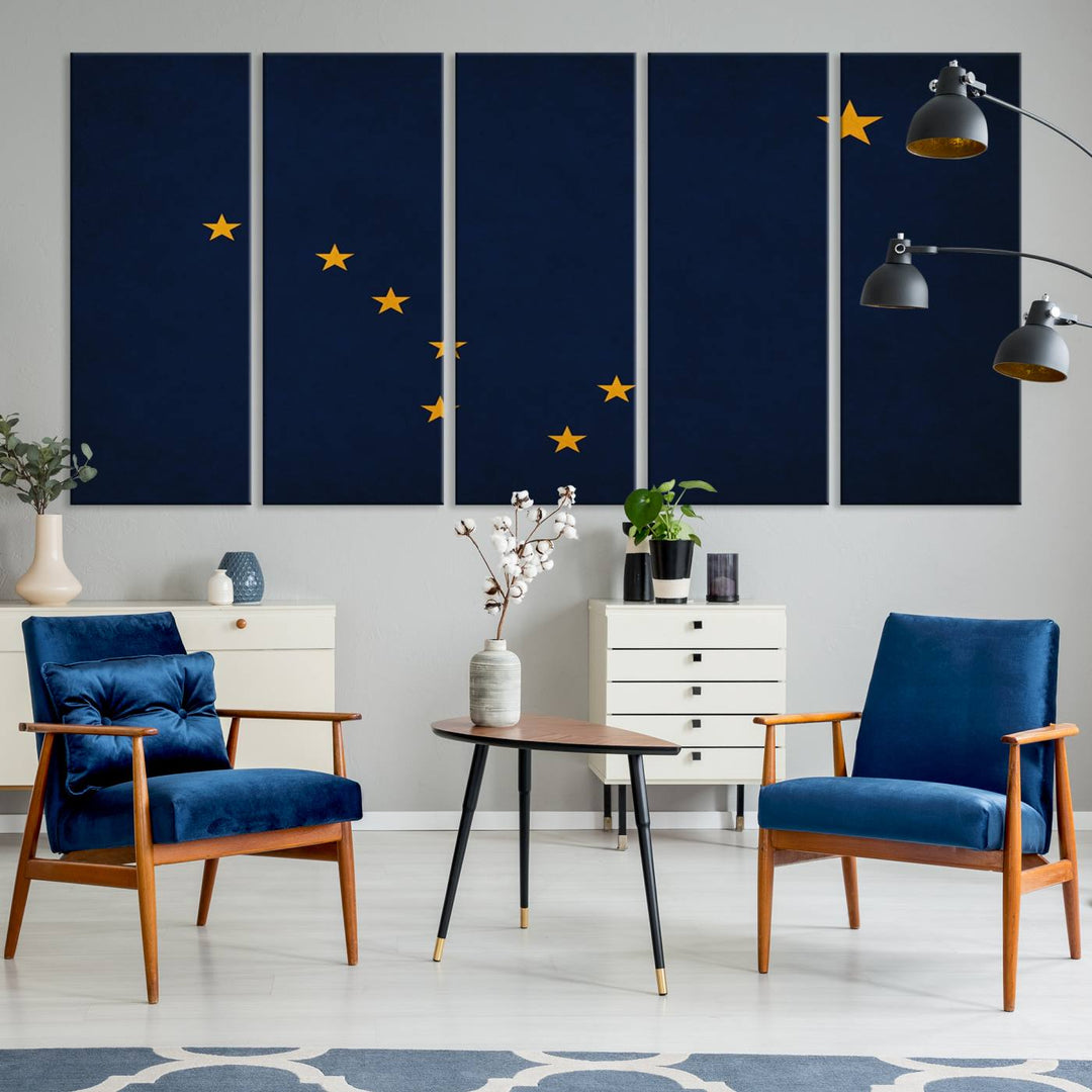 A contemporary living room featuring a triptych artwork of stars on a navy background, accentuated by the striking Alaska States Flag Wall Art Canvas Print.