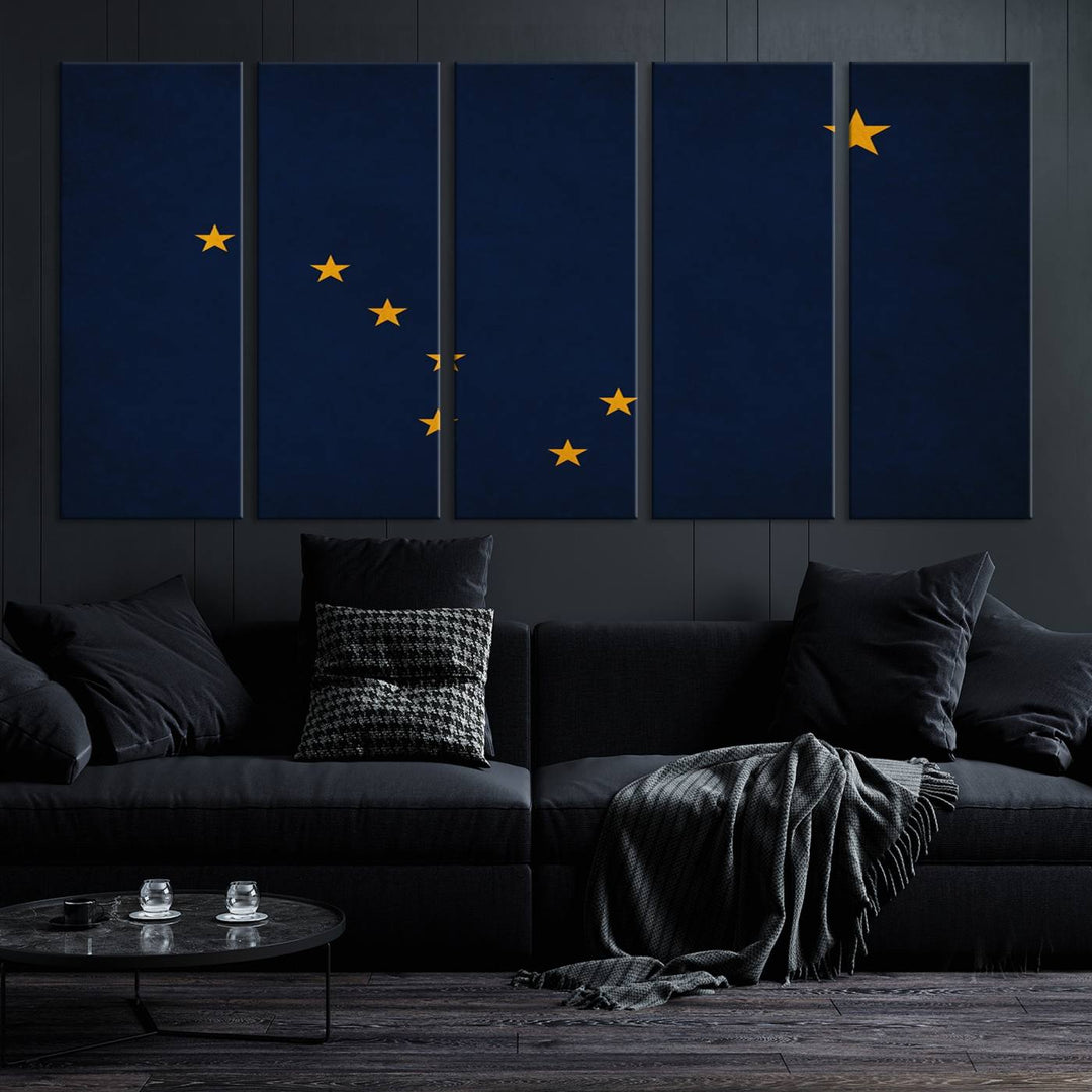 A contemporary living room featuring a triptych artwork of stars on a navy background, accentuated by the striking Alaska States Flag Wall Art Canvas Print.