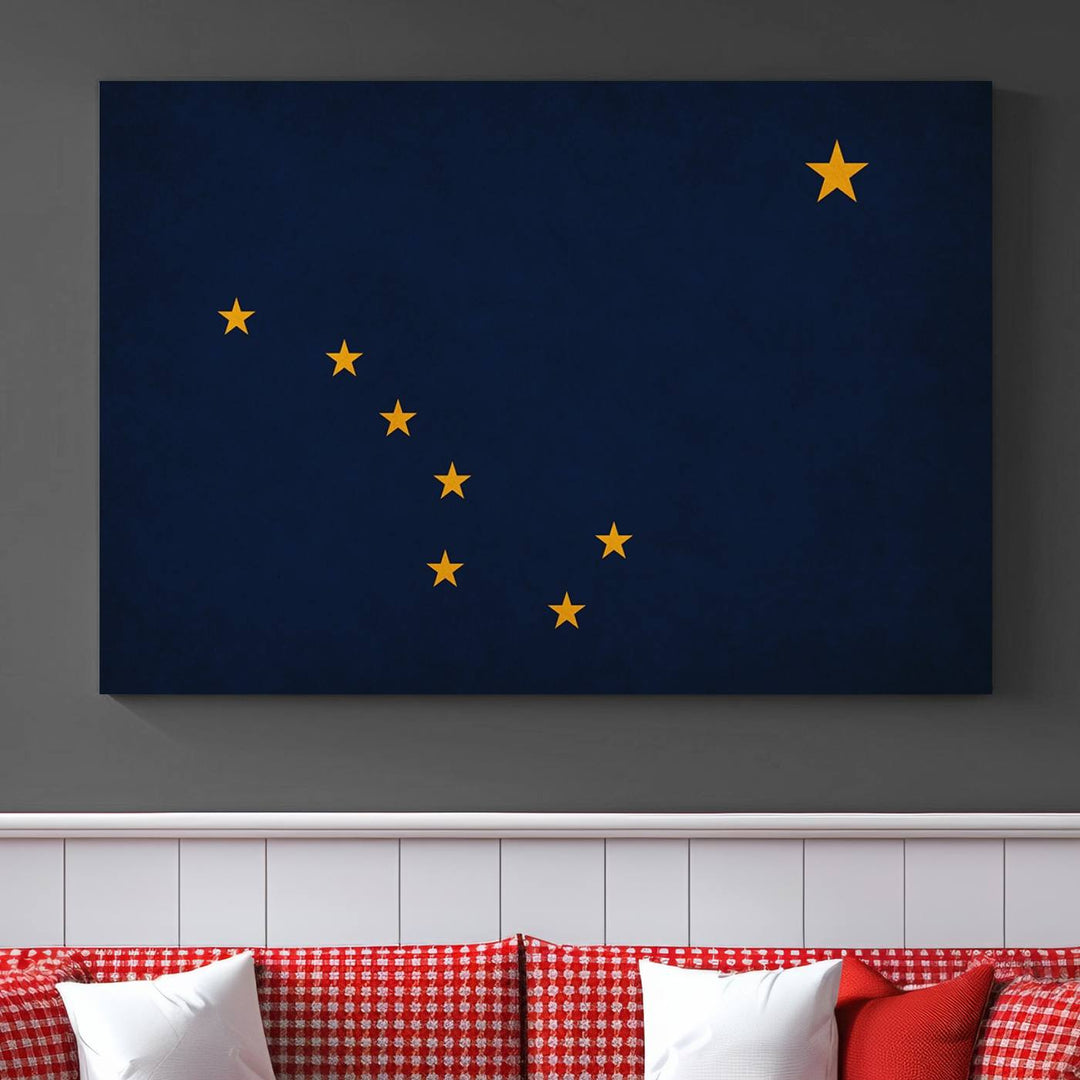 A contemporary living room featuring a triptych artwork of stars on a navy background, accentuated by the striking Alaska States Flag Wall Art Canvas Print.