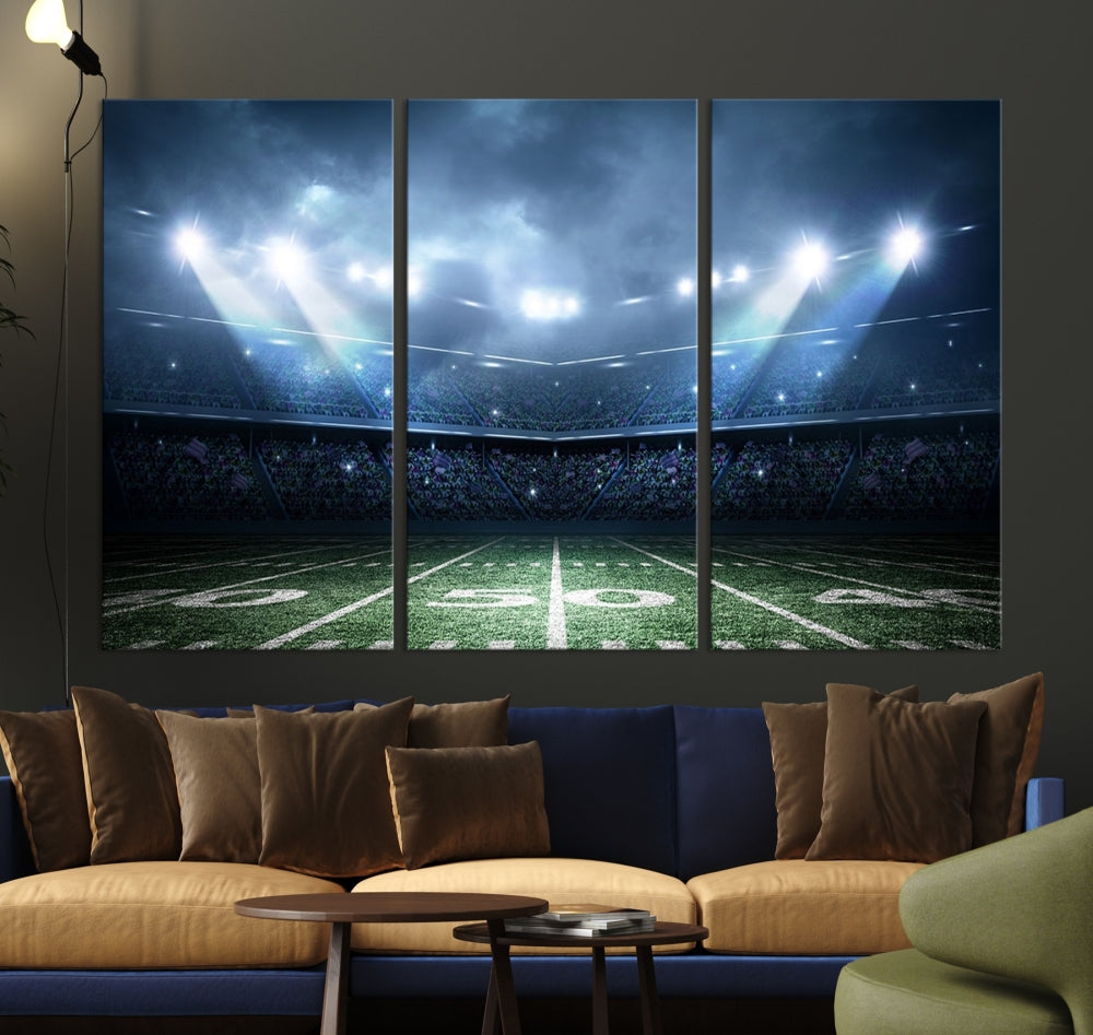 The *American Football Stadium Wall Art Canvas Print*, showcasing a lit football stadium, hangs prominently.