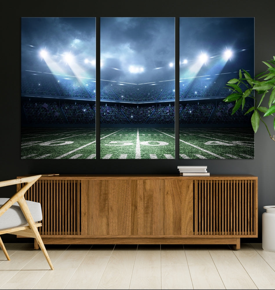 The *American Football Stadium Wall Art Canvas Print*, showcasing a lit football stadium, hangs prominently.