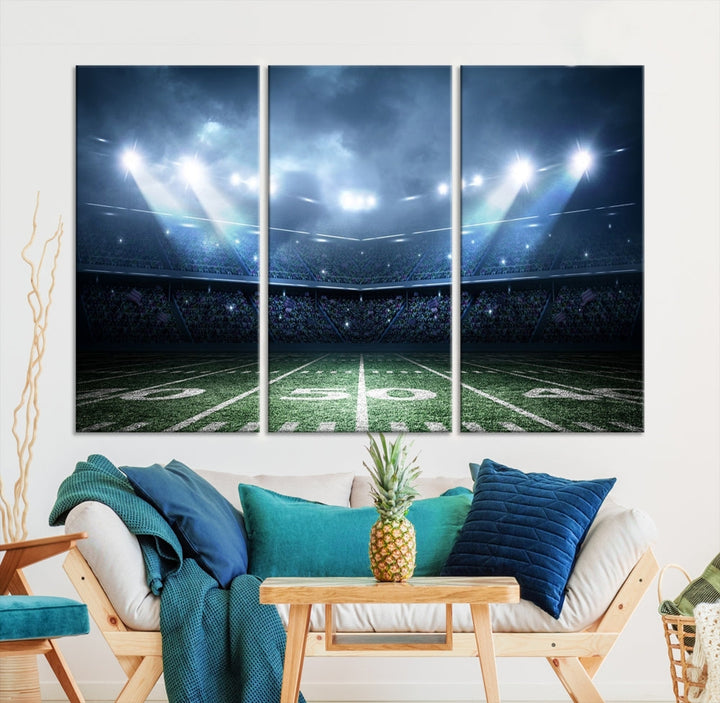 The *American Football Stadium Wall Art Canvas Print*, showcasing a lit football stadium, hangs prominently.