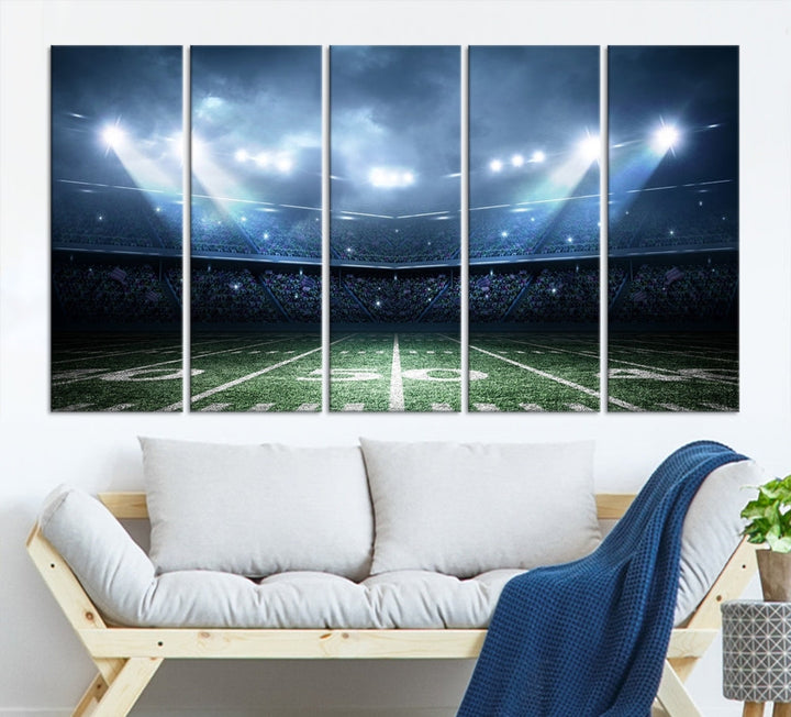 The *American Football Stadium Wall Art Canvas Print*, showcasing a lit football stadium, hangs prominently.