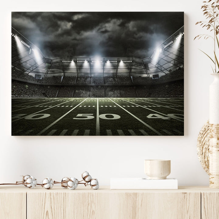 A print of an American football stadium elegantly hangs on the wall. This striking wall art piece, crafted on museum-quality canvas, features gallery wrapped edges for a polished appearance. Enjoy free shipping on this stunning artwork, known as the American Football Stadium Wall Art Canvas Print or Stadium Sport Wall Art Print.