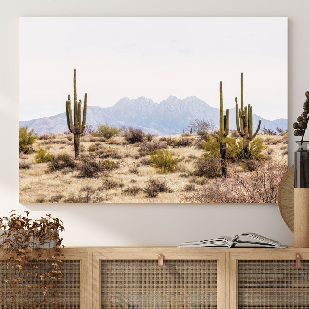 The Arizona Desert Wall Art Print, featuring saguaro cacti and framed for a farmhouse decor aesthetic, beautifully highlights a Southwestern landscape with distant mountains.