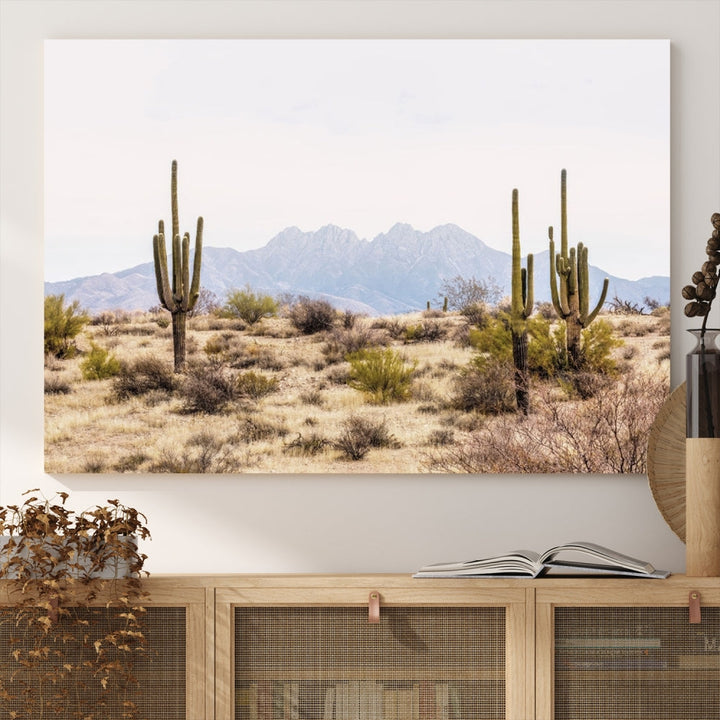 The Arizona Desert Wall Art Print, featuring saguaro cacti and framed for a farmhouse decor aesthetic, beautifully highlights a Southwestern landscape with distant mountains.