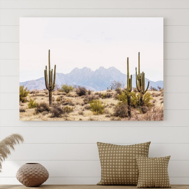 The Arizona Desert Wall Art Print, featuring saguaro cacti and framed for a farmhouse decor aesthetic, beautifully highlights a Southwestern landscape with distant mountains.