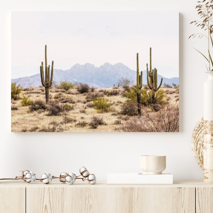 The Arizona Desert Wall Art Print, featuring saguaro cacti and framed for a farmhouse decor aesthetic, beautifully highlights a Southwestern landscape with distant mountains.