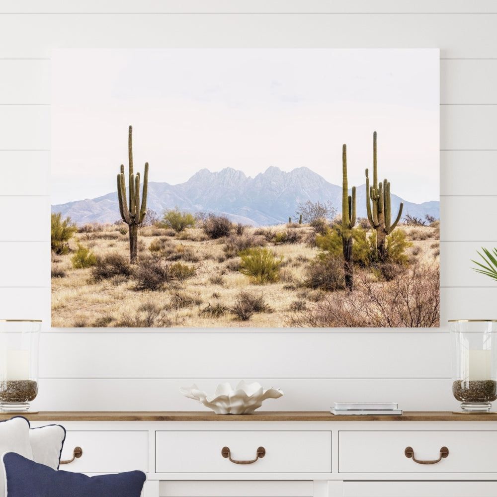 The Arizona Desert Wall Art Print, featuring saguaro cacti and framed for a farmhouse decor aesthetic, beautifully highlights a Southwestern landscape with distant mountains.