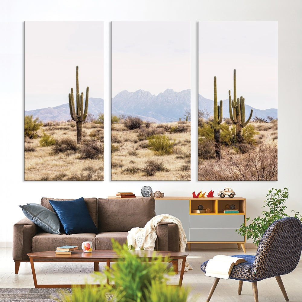 The Arizona Desert Wall Art Print, featuring saguaro cacti and framed for a farmhouse decor aesthetic, beautifully highlights a Southwestern landscape with distant mountains.