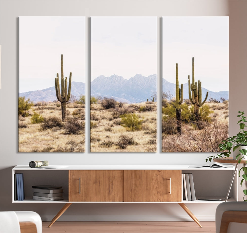 The Arizona Desert Wall Art Print, featuring saguaro cacti and framed for a farmhouse decor aesthetic, beautifully highlights a Southwestern landscape with distant mountains.