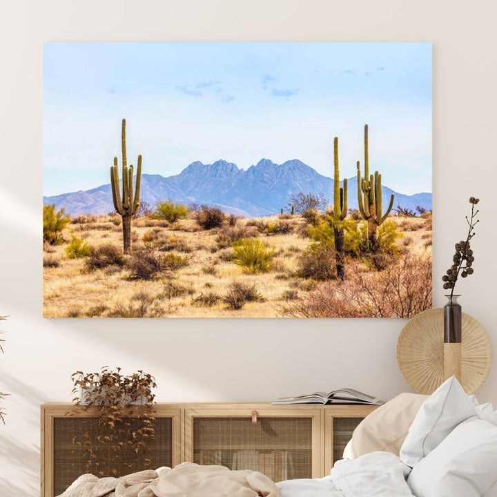 The Arizona Desert Cactus Wall Art Canvas Print, positioned above the console in a modern room, showcases a triptych desert landscape featuring cacti and mountains. Crafted on museum-quality polycotton canvas, it is finished with gallery-wrapped edges and an advanced UV-protective coating.