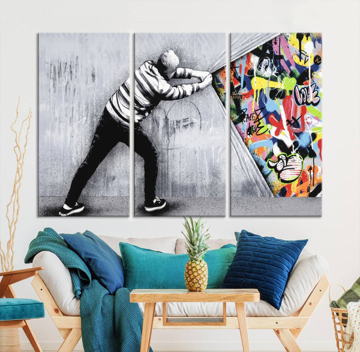 Triptych featuring the Banksy Art Behind the Curtain Street Wall Art Canvas Print, where a person peels away a gray wall to reveal vibrant urban graffiti, reminiscent of dynamic street art.