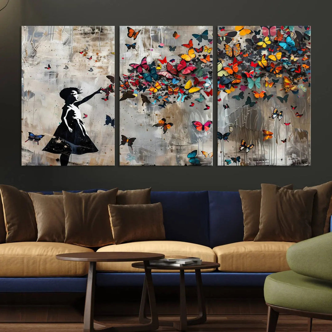 The Banksy Butterfly Girl 3-piece canvas art showcases a silhouette of a girl surrounded by colorful butterflies, perfect for modern living room decor.