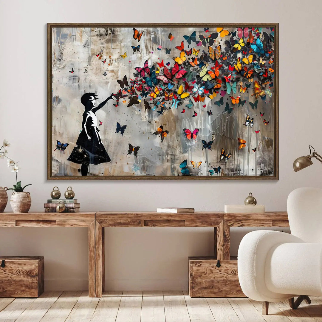 The Banksy Butterfly Girl 3-piece canvas art showcases a silhouette of a girl surrounded by colorful butterflies, perfect for modern living room decor.