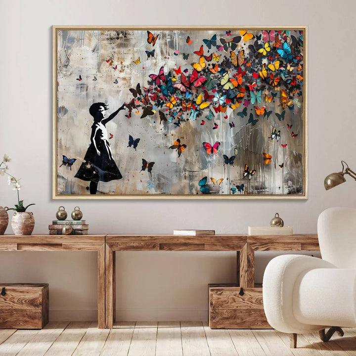 The Banksy Butterfly Girl 3-piece canvas art showcases a silhouette of a girl surrounded by colorful butterflies, perfect for modern living room decor.