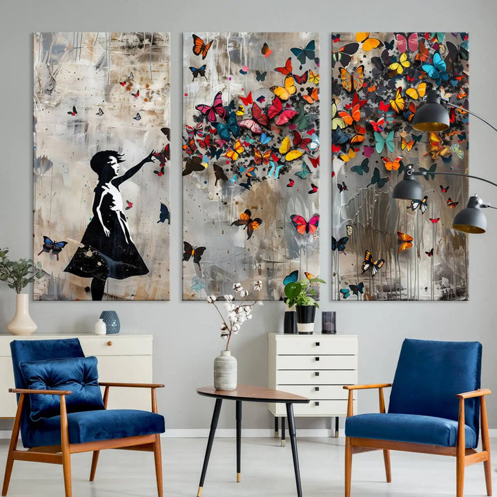 The Banksy Butterfly Girl 3-piece canvas art showcases a silhouette of a girl surrounded by colorful butterflies, perfect for modern living room decor.