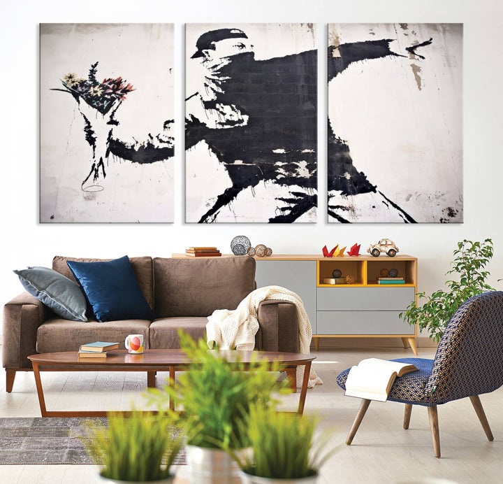 The living room features a split-panel art piece named "Banksy Flower Throw Graffiti Street Wall Art Canvas Print," gallery wrapped on museum-quality polycotton canvas and accentuated by modern decor elements.