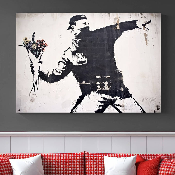 The living room features a split-panel art piece named "Banksy Flower Throw Graffiti Street Wall Art Canvas Print," gallery wrapped on museum-quality polycotton canvas and accentuated by modern decor elements.