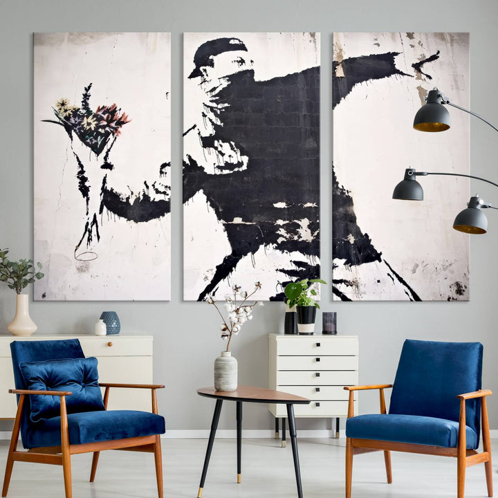 The living room features a split-panel art piece named "Banksy Flower Throw Graffiti Street Wall Art Canvas Print," gallery wrapped on museum-quality polycotton canvas and accentuated by modern decor elements.