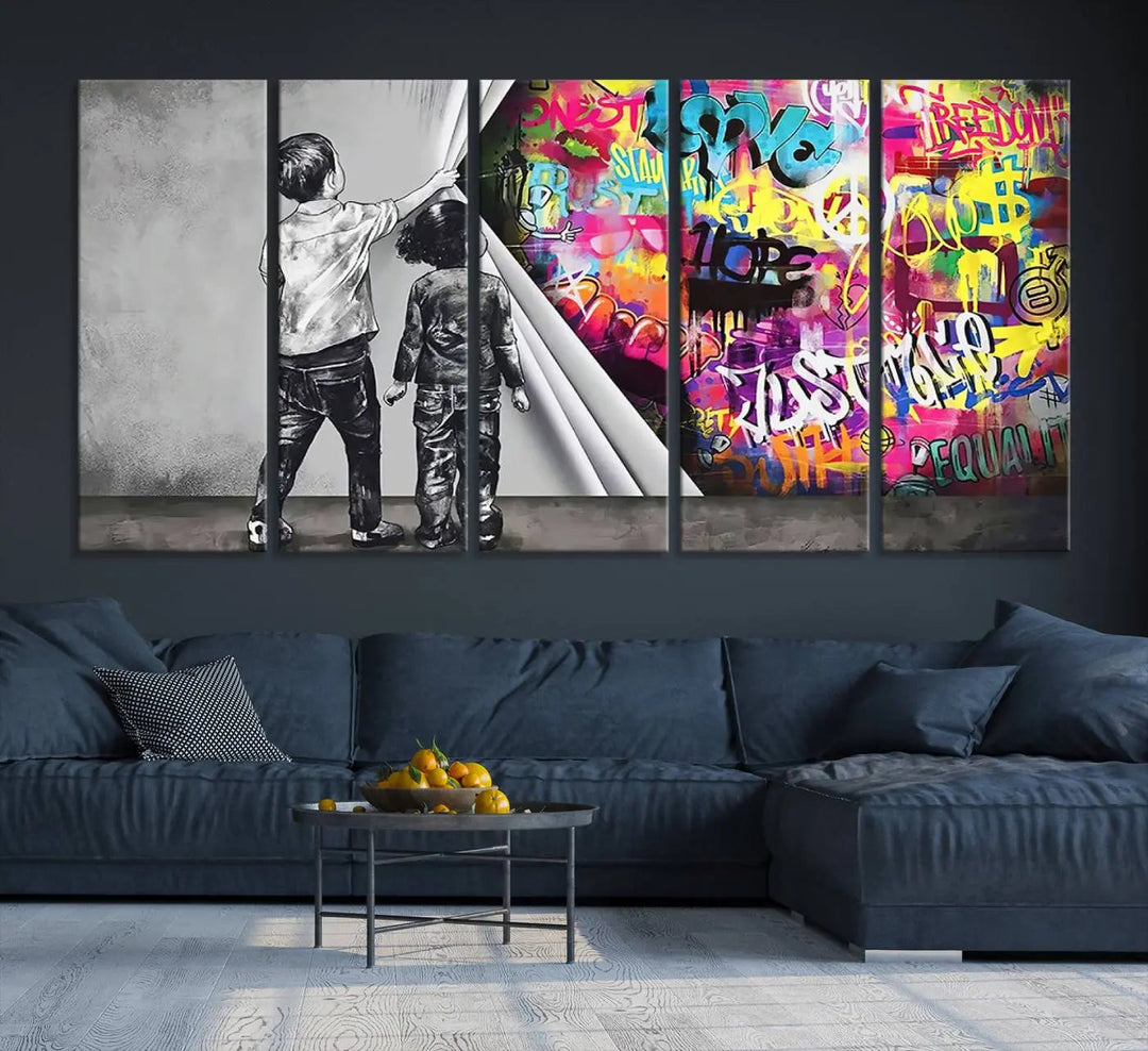 The Banksy Print - Street Art Canvas features a vibrant and bold image of two children lifting a curtain to reveal colorful graffiti. It's ready to hang, adding an urban modern decor vibe.