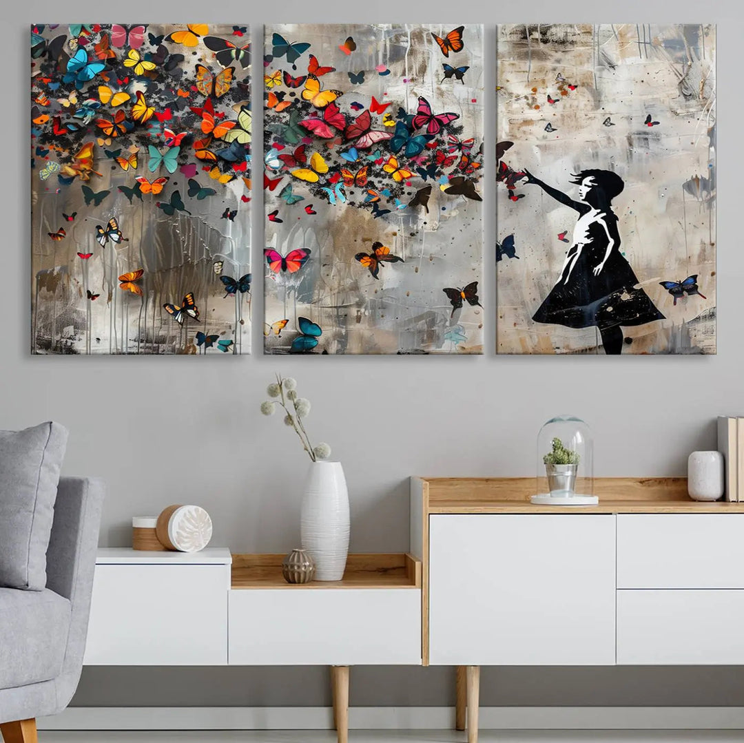 A triptych canvas print titled "Banksy Girl and Butterfly Explosion," showcasing a girl releasing colorful butterflies, enhances the space with its vibrant design. This abstract artwork is perfect for those seeking lively home decor and comes ready to hang.